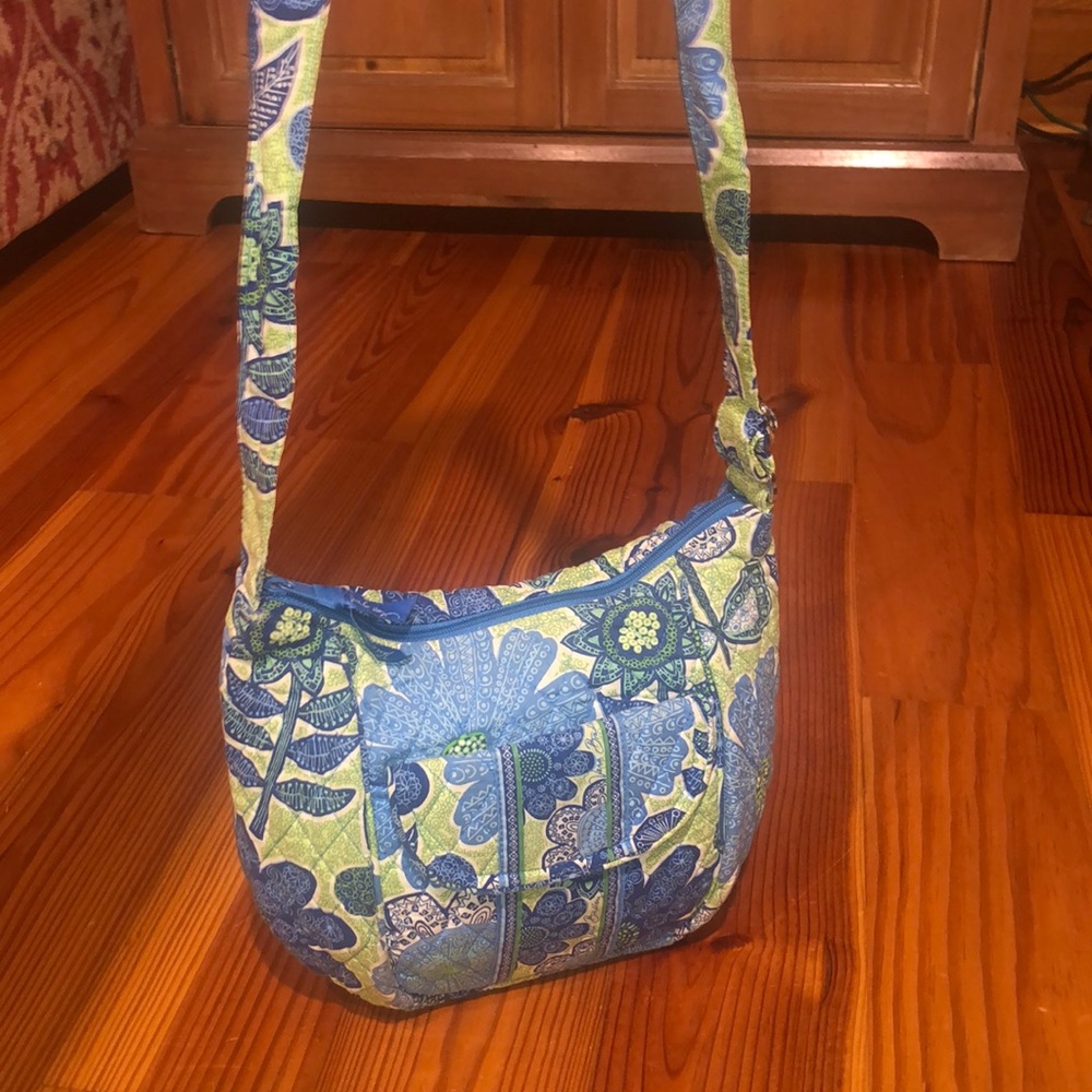 Vera Bradley purse. Colors blue green and white. Measures 9x7x3.5